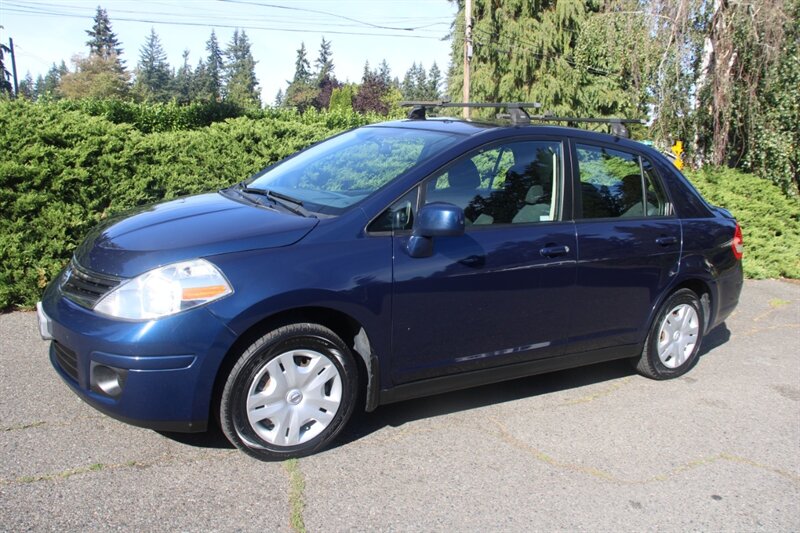 Blue 2011 Nissan Versa Sedan Front-Wheel Drive Automatic