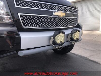 2011 Chevrolet Suburban LTZ  *Bad Ass Extended Arm Long Travel Lifted Burb! - Photo 18 - Tucson, AZ 85705