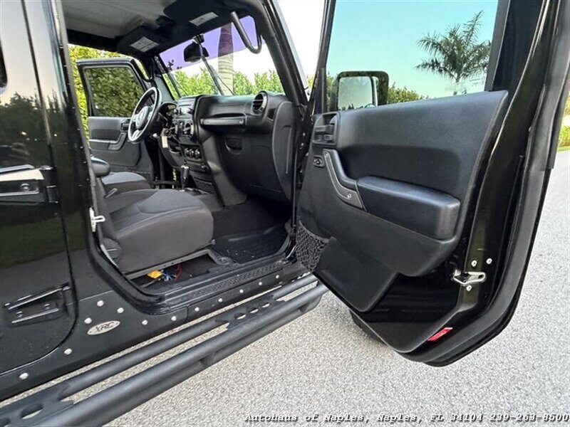 2017 Jeep Wrangler Unlimited Sport   - Photo 30 - Naples, FL 34104