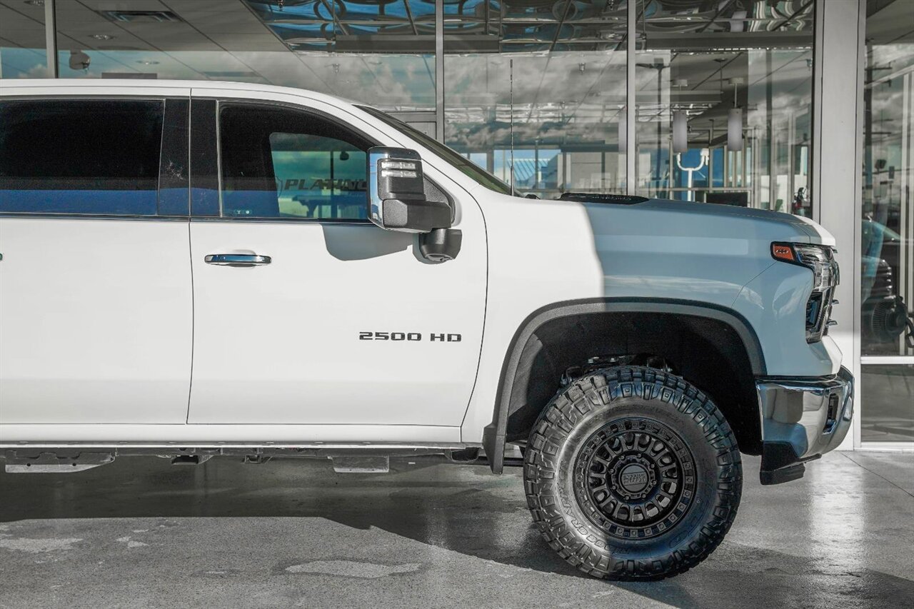 2024 Chevrolet Silverado 2500HD LTZ  Level Kit - KMC Wheels - Nitto Tires - Rhino Liner - Photo 10 - Victorville, CA 92392