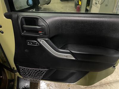 2013 Jeep Wrangler Sahara   - Photo 18 - Saint Louis, MI 48880-9800
