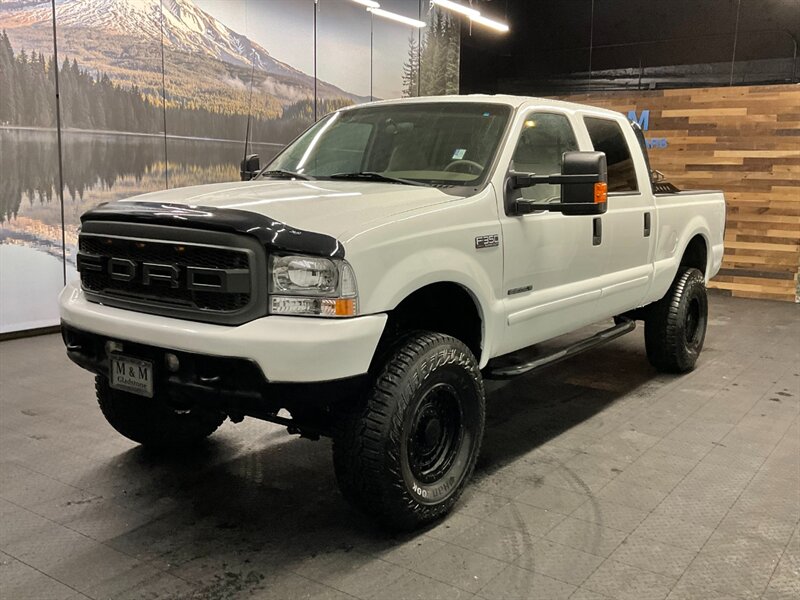 2001 Ford F-350 Lariat Crew Cab 4X4 / 7.3L DIESEL / 6-SPEED MANUAL  BRAND NEW 4 " LIFT KIT w/ BRAND NEW WHEELS & TIRES / 6-SPEED / RUST FREE / ONLY 115,000 MILES / SHARP & CLEAN - Photo 1 - Gladstone, OR 97027