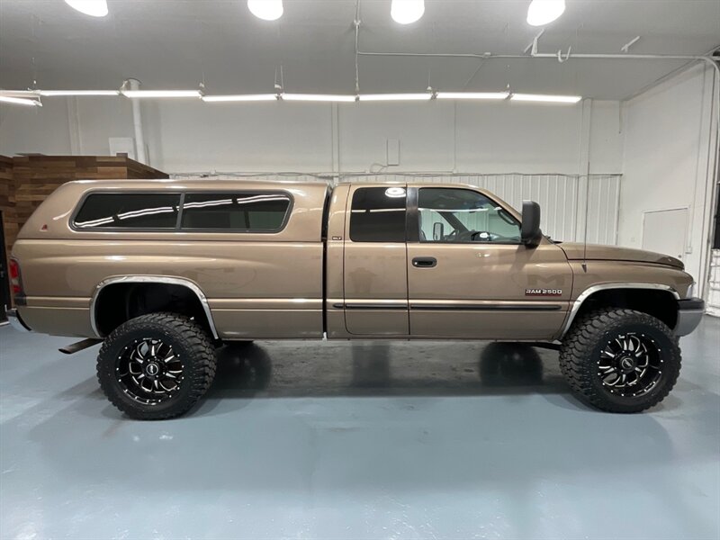 2001 Dodge Ram 2500 SLT Laramie Quad Cab 4X4 /5.9L DIESEL / 5-SPEED / LONG BED / LEVELED W. BRAND NEW WHEELS & TIRES / ZERO RUST / Rear airbags / ONLY 111K MILES - Photo 4 - Gladstone, OR 97027