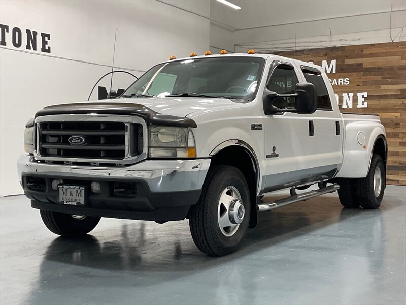 2002 Ford F-350 Lariat 4X4 / 7.3L DIESEL /6-SPEED/DUALLY/91K MILES  / ZERO RUST / Crew Cab / Leather Heated Seats / 1-TON Super Duty / 6-SPEED MANUAL / SHORT BED - Photo 1 - Gladstone, OR 97027