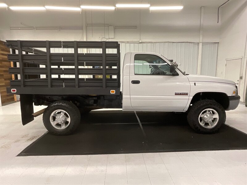 2001 Dodge Ram 2500 2-Door 4X4 / 5.9L DIESEL / 6-SPEED / TILT UP BED  / 1-OWNER LOCAL OREGON TRUCK / RUST FREE / FLAT BED TILT UP / STANDARD CAB / 158,000 MILES - Photo 12 - Gladstone, OR 97027