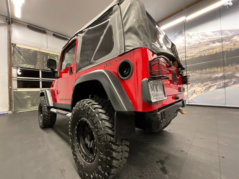 2005 Jeep Wrangler Rubicon 2Dr 4X4 / 4.0L 6Cyl / 6-SPEED / LIFTED  BRAND NEW TOP / LIFTED w/ MUD TIRES / WINCH & GRILL GUARD / SHARP & CLEAN !! - Photo 12 - Gladstone, OR 97027