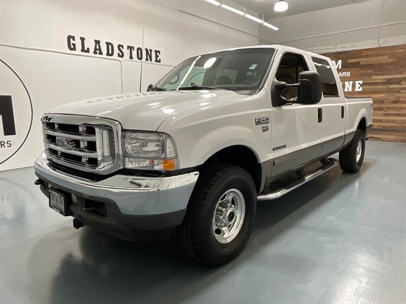 2002 Ford F-250 Lariat Crew Cab 4X4 / 7.3L DIESEL / 1-OWNER  / ZERO RUST / Leather Heated Seats / 122K MILES - Photo 1 - Gladstone, OR 97027