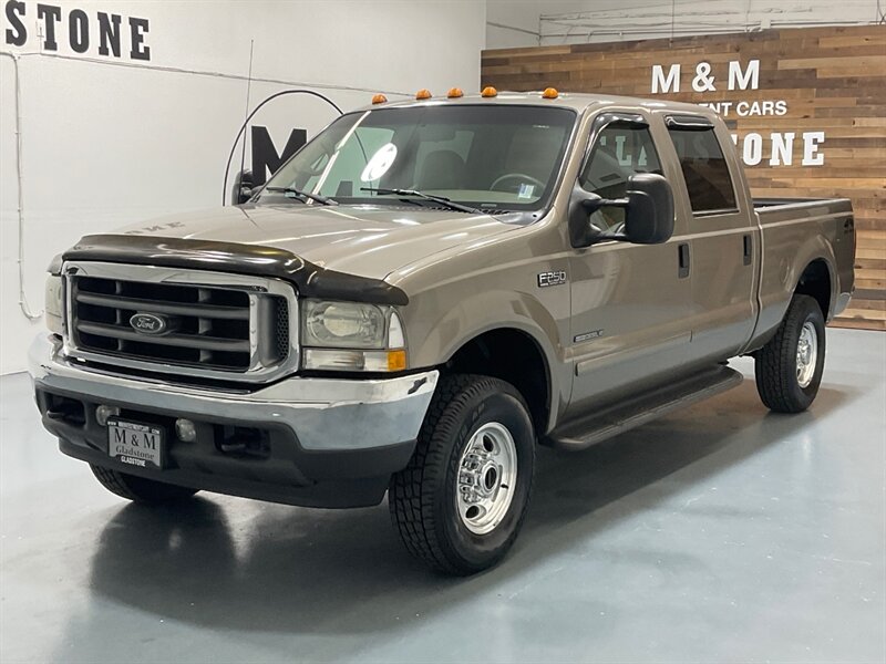2002 Ford F-250 Lariat Crew Cab 4X4 / 7.3L DIESEL / 1-OWNER  / 4X4 OFF RD PKG / Short Bed / Leather Seats / NEW TIRES / ZERO RUST / LOW MILES - Photo 1 - Gladstone, OR 97027