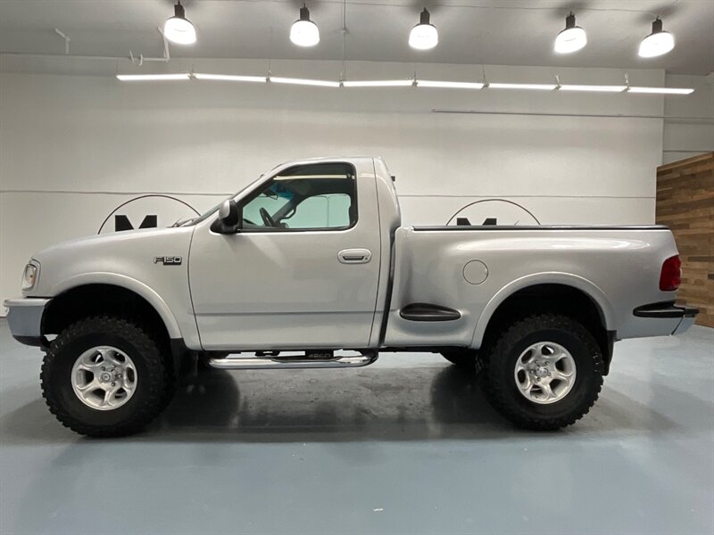 1997 Ford F-150 XLT Regular Cab 4X4 / 4.6L V8 / 5-SPEED MANUAL / LIFTED w. BRAND NEW TIRES / ZERO RUST - Photo 3 - Gladstone, OR 97027