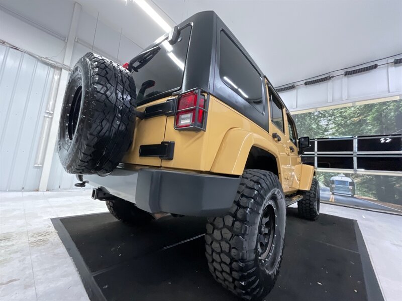 2014 Jeep Wrangler Unlimited Freedom Edition 4X4 / 3.6L V6 / LIFTED  / HARD TOP / LIFTED w. 35 " MUD TIRES & 16 " BLACK WHEELS - Photo 26 - Gladstone, OR 97027