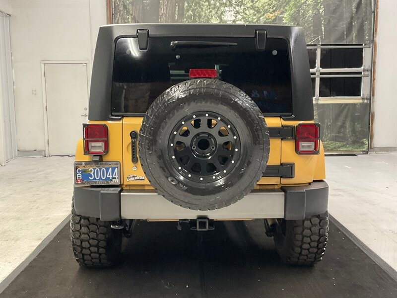 2014 Jeep Wrangler Unlimited Freedom Edition 4X4 / 3.6L V6 / LIFTED  / HARD TOP / LIFTED w. 35 " MUD TIRES & 16 " BLACK WHEELS - Photo 6 - Gladstone, OR 97027