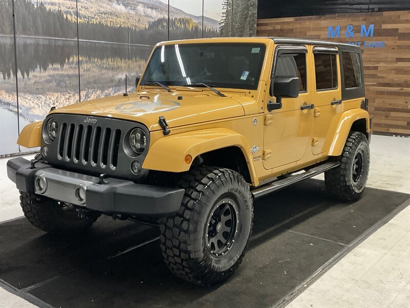 2014 Jeep Wrangler Unlimited Freedom Edition 4X4 / 3.6L V6 / LIFTED  / HARD TOP / LIFTED w. 35 " MUD TIRES & 16 " BLACK WHEELS - Photo 1 - Gladstone, OR 97027