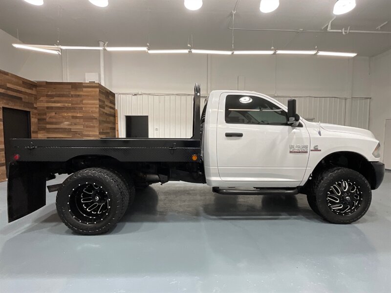 2013 RAM 3500 Tradesman Regular Cab 4X4 / 6.7L DIESEL / DUALLY / FLAT BED / LONG BED / ZERO RUST / FUEL WHEELS / TRAILER BRAKE CONTROLLER - Photo 4 - Gladstone, OR 97027
