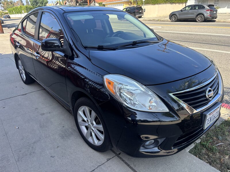Black 2014 Nissan Versa Sedan Front-Wheel Drive Automatic