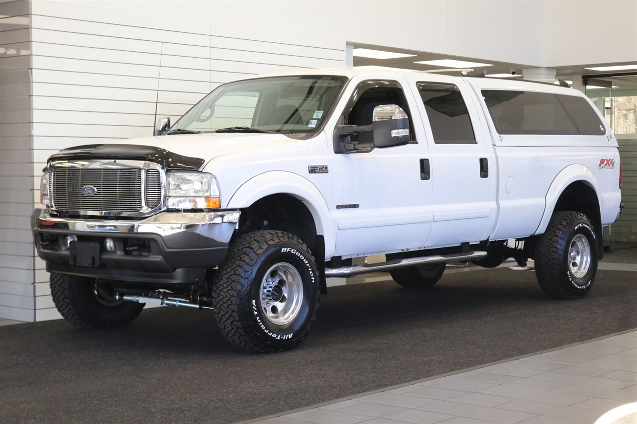 2002 Ford F-350 XLT  1-OWNER* 100% RUST FREE* 55K MLS ONLY* DEALER SERVICED SINCE NEW* NEW 35 " BFG KO3s W/ 3 " LEVEL LIFT & NEW BILSTEIN 5100s & DUAL BILSTEIN STEERING STABILIZERS*LINEX BED LINER*ALL BOOKS/MANUALS/KEYS - Photo 1 - Portland, OR 97230