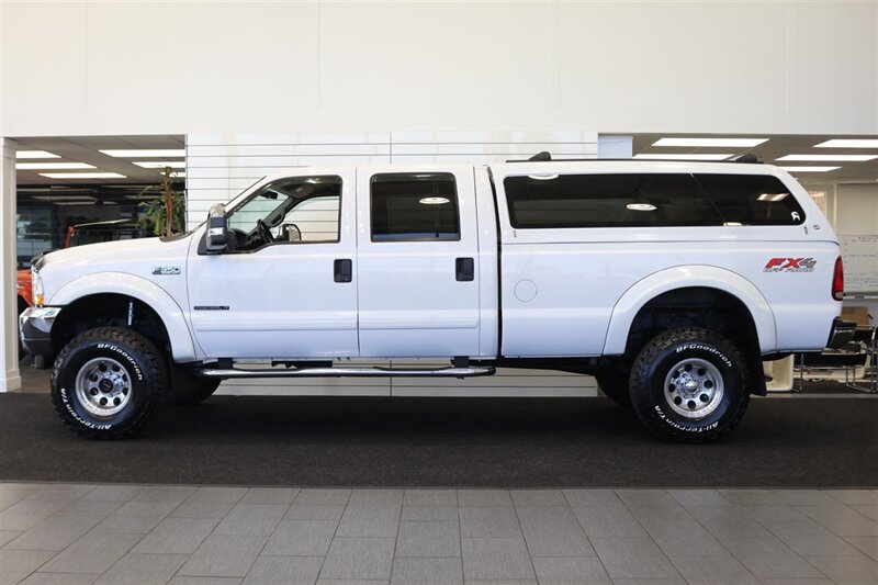2002 Ford F-350 XLT  1-OWNER* 100% RUST FREE* 55K MLS ONLY* DEALER SERVICED SINCE NEW* NEW 35 " BFG KO3s W/ 3 " LEVEL LIFT & NEW BILSTEIN 5100s & DUAL BILSTEIN STEERING STABILIZERS*LINEX BED LINER*ALL BOOKS/MANUALS/KEYS - Photo 4 - Portland, OR 97230