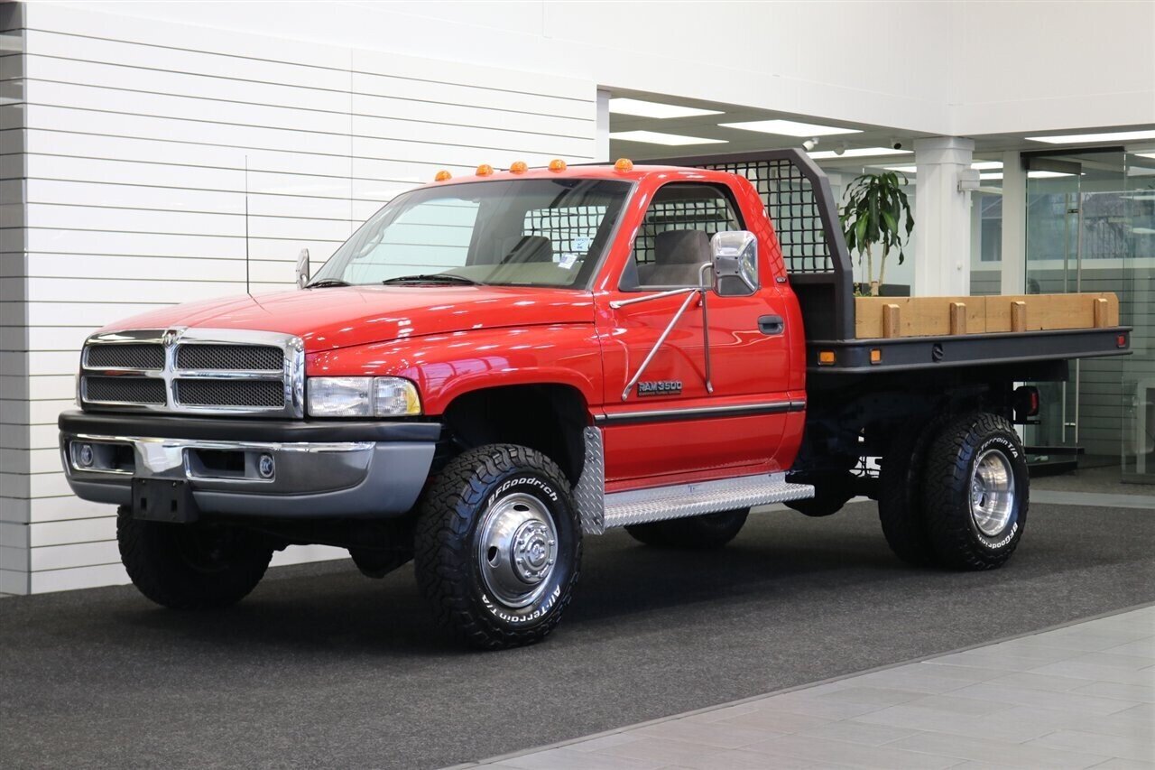 1995 Dodge Ram 3500  1-OWNER* 12-VALVE 5.9L* 5 SPD MANUAL* FLAT BED W/ NEW WOOD* NEW BFG KO3 10-PLYS* NEW CLUTCH* KILLER DOWEL PIN REPLACED* ALL NEW FLUIDS-REAR BRAKES-AC SERVICE* 100% RUST FREE* NEW CLUTCH-REAR MAIN SEAL - Photo 1 - Portland, OR 97230