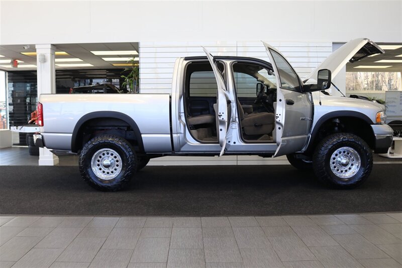 2004 Dodge Ram 2500 SLT 4dr Quad Cab SLT  1-OWNER* 6-SPEED MANUAL* 5.9L HIGH OUTPUT* NEW 3 "BILSTEIN LEVEL KIT* BILSTEIN 5100 SHOCKS* NEW 35 " NITTO G3 10-PLYs* REAR AIR BAGS* SPRAY IN BED LINER* AFE COLD AIR INTAKE - Photo 11 - Portland, OR 97230
