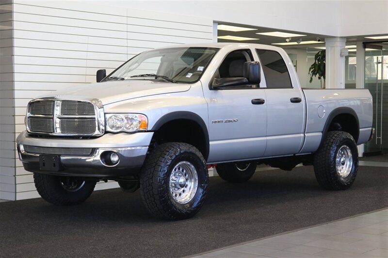 2004 Dodge Ram 2500 SLT 4dr Quad Cab SLT  1-OWNER* 6-SPEED MANUAL* 5.9L HIGH OUTPUT* NEW 3 "BILSTEIN LEVEL KIT* BILSTEIN 5100 SHOCKS* NEW 35 " NITTO G3 10-PLYs* REAR AIR BAGS* SPRAY IN BED LINER* AFE COLD AIR INTAKE - Photo 3 - Portland, OR 97230
