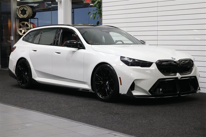 2025 BMW M5 Touring  141K MSRP* CARBON CERAMIC BRAKES-EXECUTIVE PKG - M-DRIVER PKG* CARBON FIBER FRONT SPLITTER - CARBON REAR DIFFUESER - CARBON SIDE SKIRTS - H&R LOWERING SPRINGS* DOWN PIPES & COLD AIR INTAKES