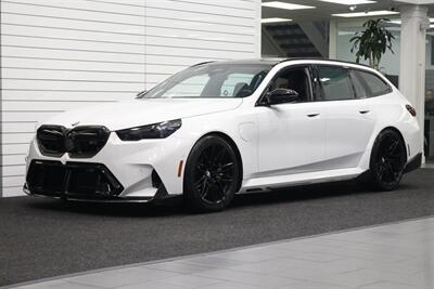 2025 BMW M5 Touring  141K MSRP* CARBON CERAMIC BRAKES-EXECUTIVE PKG - M-DRIVER PKG* CARBON FIBER FRONT SPLITTER - CARBON REAR DIFFUESER - CARBON SIDE SKIRTS - H&R LOWERING SPRINGS* DOWN PIPES & COLD AIR INTAKES - Photo 1 - Portland, OR 97230