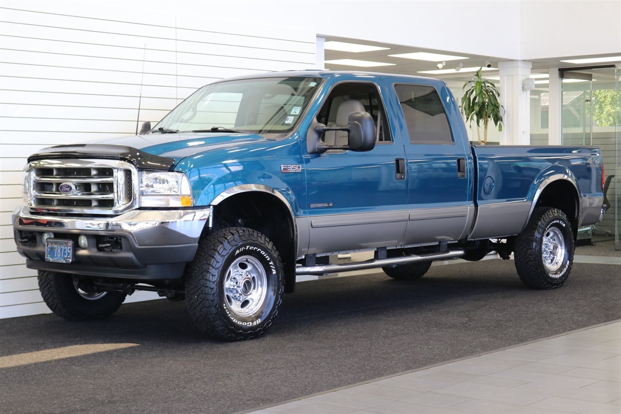 2002 Ford F-350 Super Duty Lariat 4dr Crew Cab Lariat  1-OWNER* NEVER HAD 5TH WHEEL-GOOSENECK* 0-RUST* ALL BOOKS-SERVICE RECORDS SINCE NEW-KEYS-WINDOW STICKER* NEW 2.5 "LEVEL LIFT W/ NEW 33 "BFG KO3s & BILSTEIN 5100s/ NEW BRAKES - ROTORS - Photo 1 - Portland, OR 97230