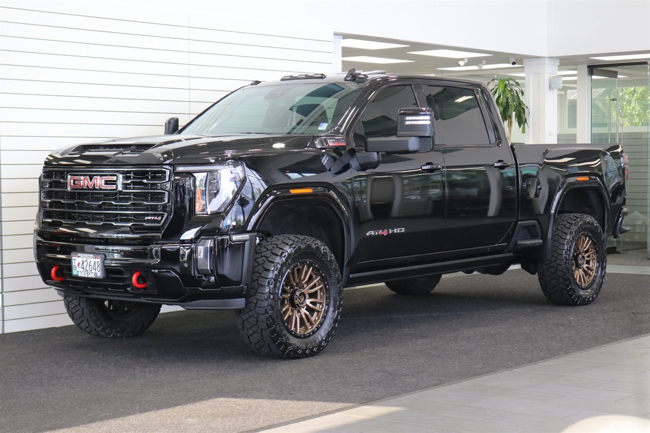 2024 GMC Sierra 3500 AT4  1-OWNER* 4 " COGNITO LIFT W/ FOX SHOCKS* 20 " FUELS 35 " TOYO R/Ts* AT4 PREM PLUS PKG*  PAINT MATCHED FLARES* FULL FRONT PPF* ALL BOOKS & 2-KEYS - Photo 1 - Portland, OR 97230