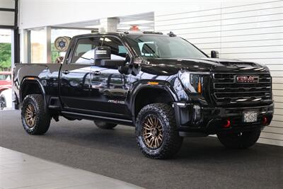 2024 GMC Sierra 3500 AT4  1-OWNER* 4 " COGNITO LIFT W/ FOX SHOCKS* 20 " FUELS 35 " TOYO R/Ts* AT4 PREM PLUS PKG*  PAINT MATCHED FLARES* FULL FRONT PPF* ALL BOOKS & 2-KEYS - Photo 2 - Portland, OR 97230