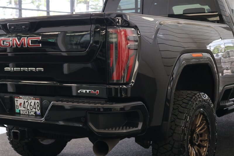 2024 GMC Sierra 3500 AT4  1-OWNER* 4 " COGNITO LIFT W/ FOX SHOCKS* 20 " FUELS 35 " TOYO R/Ts* AT4 PREM PLUS PKG*  PAINT MATCHED FLARES* FULL FRONT PPF* ALL BOOKS & 2-KEYS - Photo 14 - Portland, OR 97230
