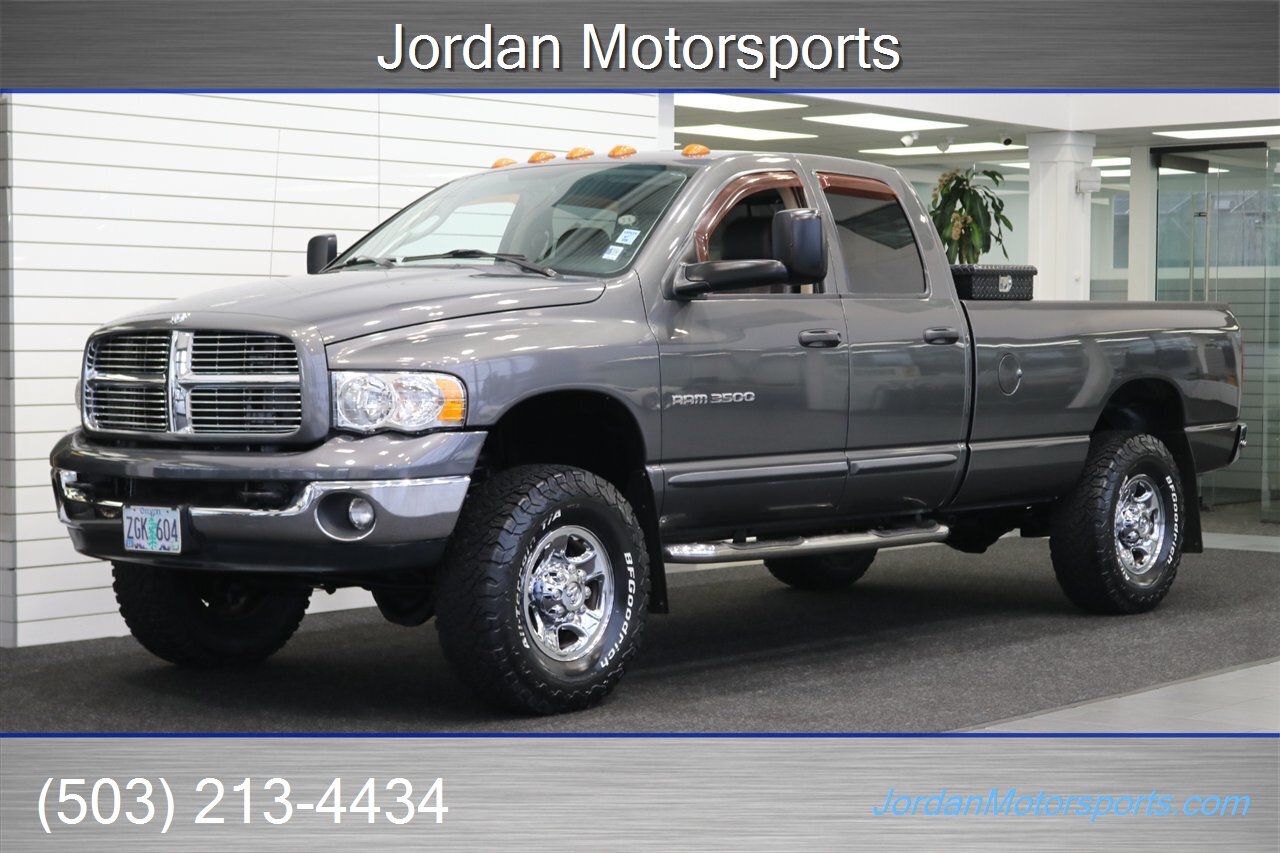 2003 Dodge Ram 3500 Laramie  1-OWNER* 100% RUST FREE* 5.9L LONG BED W/ 6-SPEED MANUAL TRANS* 82K ACTUAL MILES* PACBRAKE EXHAUST BRAKE* BANKS POWER PACKAGE* SPRAY IN BED LINER* REAR AIR BAGS* NEW BILSTEIN 5100 SERIES SHOCKS - Photo 1 - Portland, OR 97230