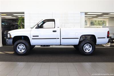 2001 Dodge Ram 2500 SLT  1-OWNER* SINGLE CAB* 5.9L CUMMINS* 6-SPEED MANUAL* 100% RUST & CORROSION FREE* LIKE NEW BED* BD EXHAUST BRAKE* AIR DOG INJECTION PUMP* MBRB FULL EXHAUST* ZERO PAINT* COLLECTOR QUALITY - Photo 4 - Portland, OR 97230