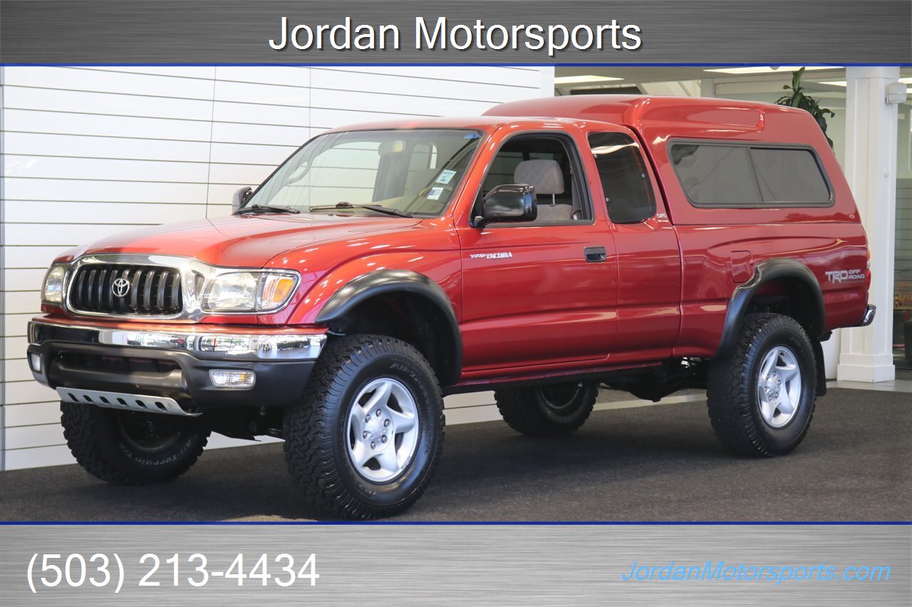 2003 Toyota Tacoma V6 1-OWNER* 87K MLS* 100% RUST & CORROSION FREE* TIMING BELT-WATER PUMP-FLUIDS SERVICED* NEW 2.5 " BILSTEIN LEVEL KIT W/DIFF DROPS* REAR LOCKERS* SR5 W/5-SPEED MANUAL* ALL BOOKS & KEYS & WINDOW STICKER - Photo 1 - Portland, OR 97230