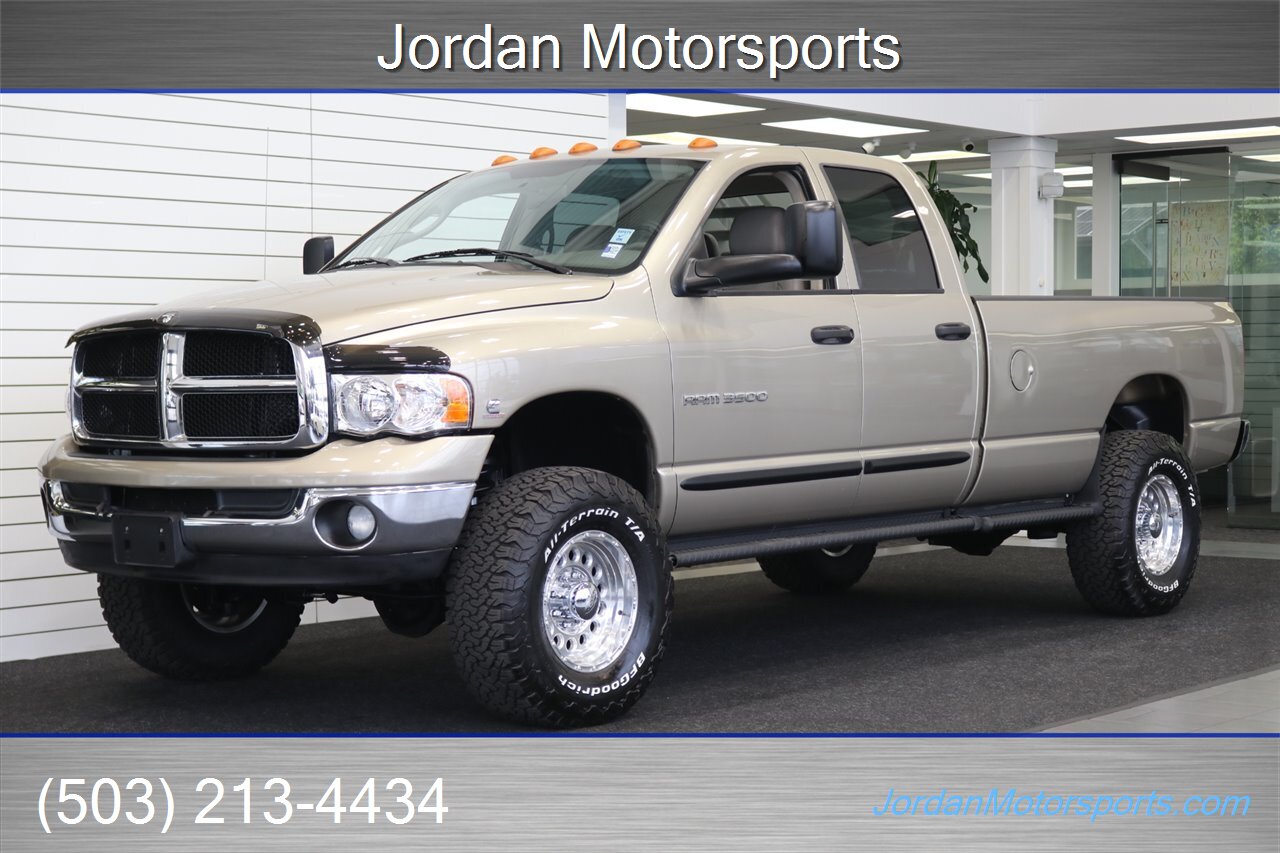 2005 Dodge Ram 3500 SLT 4dr Quad Cab 1-OWNER 100% RUST & CORROSION FREE* 5.9L HIGH OUTPUT CUMMINS* NEVER HAD 5TH WHEEL OR GOOSENECK* NEW 3 "BILSTEIN 5100 LEVEL LIFT W/NEW 35 " BFG KO3 10-PLYs* LEATHER LONG BED - Photo 1 - Portland, OR 97230