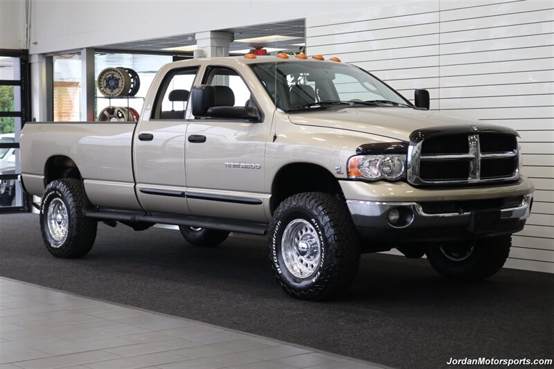 2005 Dodge Ram 3500 SLT 4dr Quad Cab  1-OWNER 100% RUST & CORROSION FREE* 5.9L HIGH OUTPUT CUMMINS* NEVER HAD 5TH WHEEL OR GOOSENECK* NEW 3 "BILSTEIN 5100 LEVEL LIFT W/NEW 35 " BFG KO3 10-PLYs* LEATHER LONG BED - Photo 2 - Portland, OR 97230