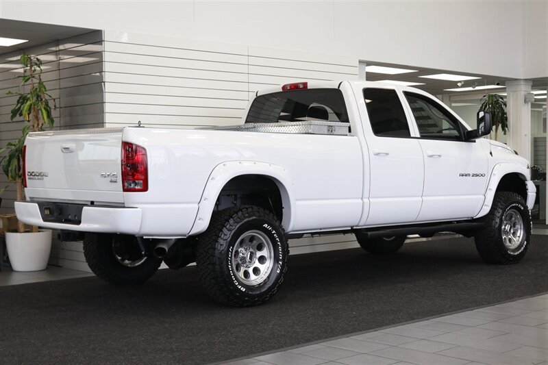 2003 Dodge Ram 2500 SLT 4dr Quad Cab SLT  1-OWNER* 6-SPEED MANUAL NV5600* 5.9L HO* 100% RUST FREE* NEW 3 "LEVEL KIT W/ NEW 35 " BFG KO3 12-PLY* NEW 17 "PRO COMPS* FULLY SERVICED* LIKE NEW IN & OUT* FULL PAINT MATCH BUMPERS-GRILLE - Photo 7 - Portland, OR 97230