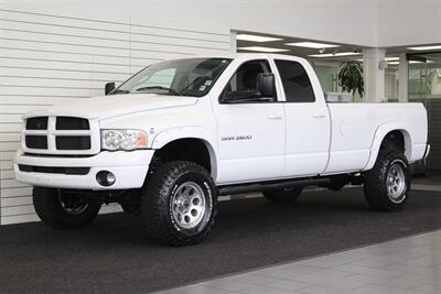 2003 Dodge Ram 2500 SLT 4dr Quad Cab SLT  1-OWNER* 6-SPEED MANUAL NV5600* 5.9L HO* 100% RUST FREE* NEW 3 "LEVEL KIT W/ NEW 35 " BFG KO3 12-PLY* NEW 17 "PRO COMPS* FULLY SERVICED* LIKE NEW IN & OUT* FULL PAINT MATCH BUMPERS-GRILLE - Photo 1 - Portland, OR 97230