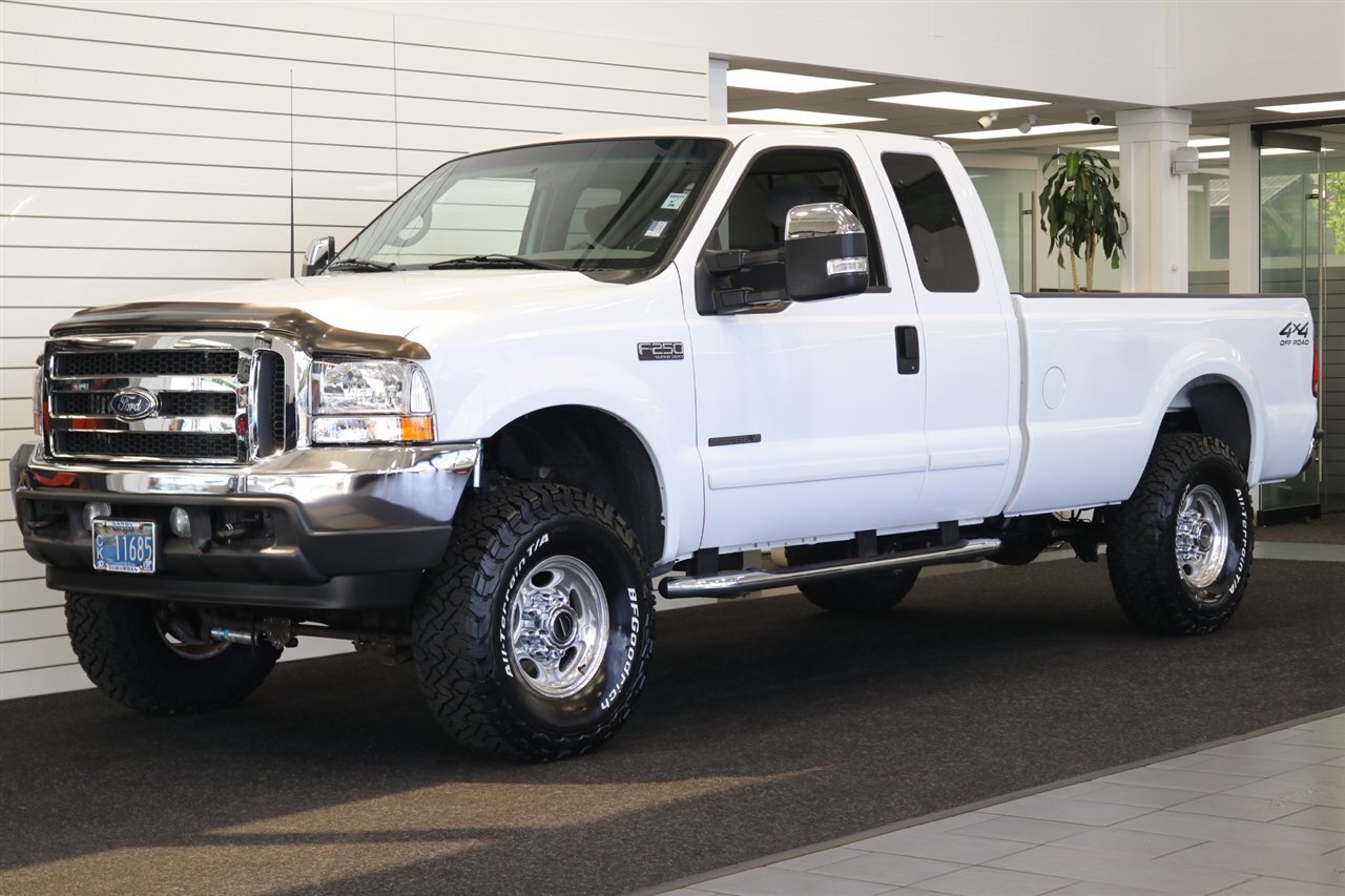 2002 Ford F-250 XLT  100% RUST FREE* 100% ACCIDENT FREE* LONG BED EXTRA CAB* LINEX BED LINER* NEW 2.5 "LEVEL KIT W/ BILSTEIN 5100 SHOCKS& STEERING STABILIZER* NEW 35 " BFG KO3 10-PLYs* UPGRADED GRILL & MIRRORS*FULL SERVICED - Photo 1 - Portland, OR 97230