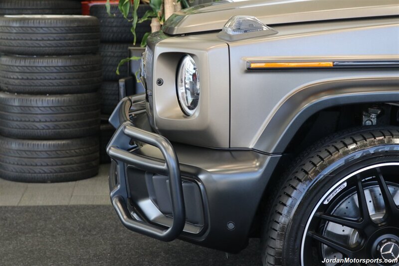 2025 Mercedes-Benz AMG G 63  1-OWNER* FULL PPF ON FRONT NOSE* MONZA GREY MAGNO-CARBON FIBER INTERIOR TRIM-22 " AMG WHEELS-EXCLUSIVE INTERIOR PLUS-AMG NIGHT PACKAGE MAGNOAMG PERFORMANCE STEERING WHEEL-BLACK MAGNO ROOF* - Photo 55 - Portland, OR 97230