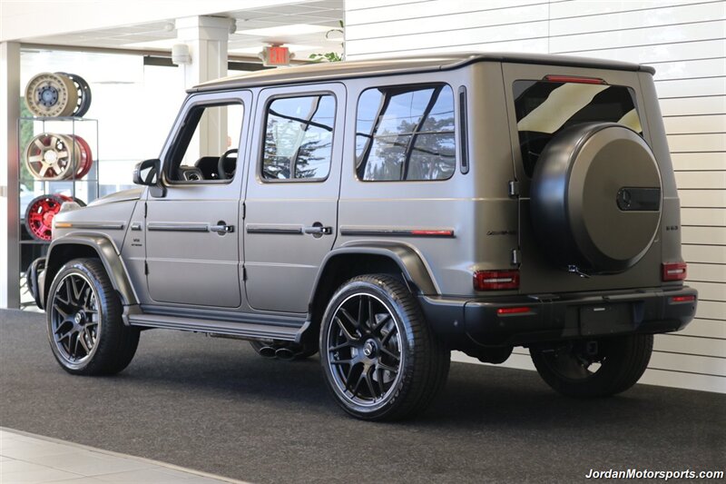2025 Mercedes-Benz AMG G 63  1-OWNER* FULL PPF ON FRONT NOSE* MONZA GREY MAGNO-CARBON FIBER INTERIOR TRIM-22 " AMG WHEELS-EXCLUSIVE INTERIOR PLUS-AMG NIGHT PACKAGE MAGNOAMG PERFORMANCE STEERING WHEEL-BLACK MAGNO ROOF* - Photo 6 - Portland, OR 97230