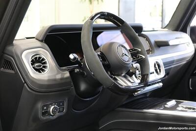 2025 Mercedes-Benz AMG G 63  1-OWNER* FULL PPF ON FRONT NOSE* MONZA GREY MAGNO-CARBON FIBER INTERIOR TRIM-22 " AMG WHEELS-EXCLUSIVE INTERIOR PLUS-AMG NIGHT PACKAGE MAGNOAMG PERFORMANCE STEERING WHEEL-BLACK MAGNO ROOF* - Photo 44 - Portland, OR 97230