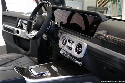 2025 Mercedes-Benz AMG G 63  1-OWNER* FULL PPF ON FRONT NOSE* MONZA GREY MAGNO-CARBON FIBER INTERIOR TRIM-22 " AMG WHEELS-EXCLUSIVE INTERIOR PLUS-AMG NIGHT PACKAGE MAGNOAMG PERFORMANCE STEERING WHEEL-BLACK MAGNO ROOF* - Photo 45 - Portland, OR 97230