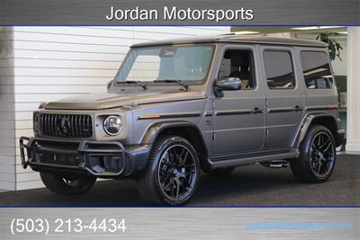 2025 Mercedes-Benz AMG G 63  1-OWNER* FULL PPF ON FRONT NOSE* MONZA GREY MAGNO-CARBON FIBER INTERIOR TRIM-22 " AMG WHEELS-EXCLUSIVE INTERIOR PLUS-AMG NIGHT PACKAGE MAGNOAMG PERFORMANCE STEERING WHEEL-BLACK MAGNO ROOF* - Photo 1 - Portland, OR 97230