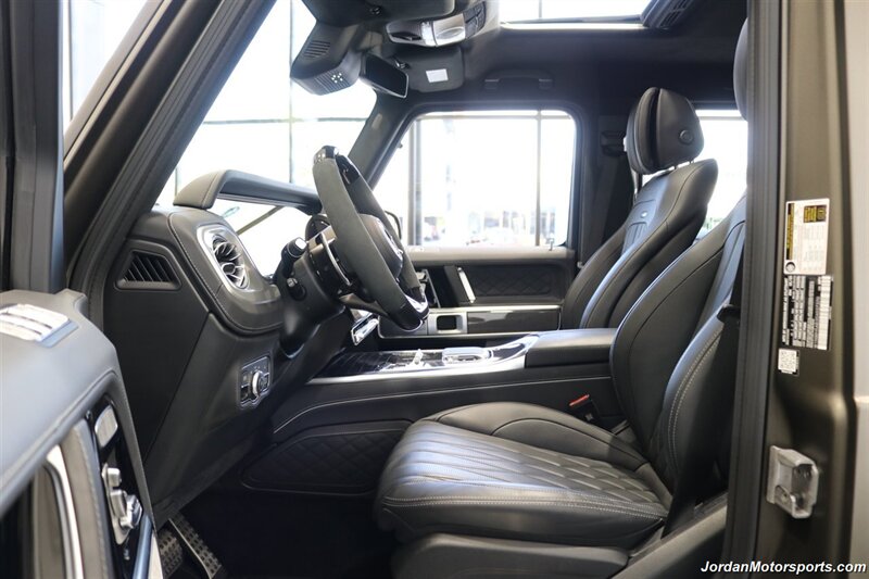 2025 Mercedes-Benz AMG G 63  1-OWNER* FULL PPF ON FRONT NOSE* MONZA GREY MAGNO-CARBON FIBER INTERIOR TRIM-22 " AMG WHEELS-EXCLUSIVE INTERIOR PLUS-AMG NIGHT PACKAGE MAGNOAMG PERFORMANCE STEERING WHEEL-BLACK MAGNO ROOF* - Photo 48 - Portland, OR 97230