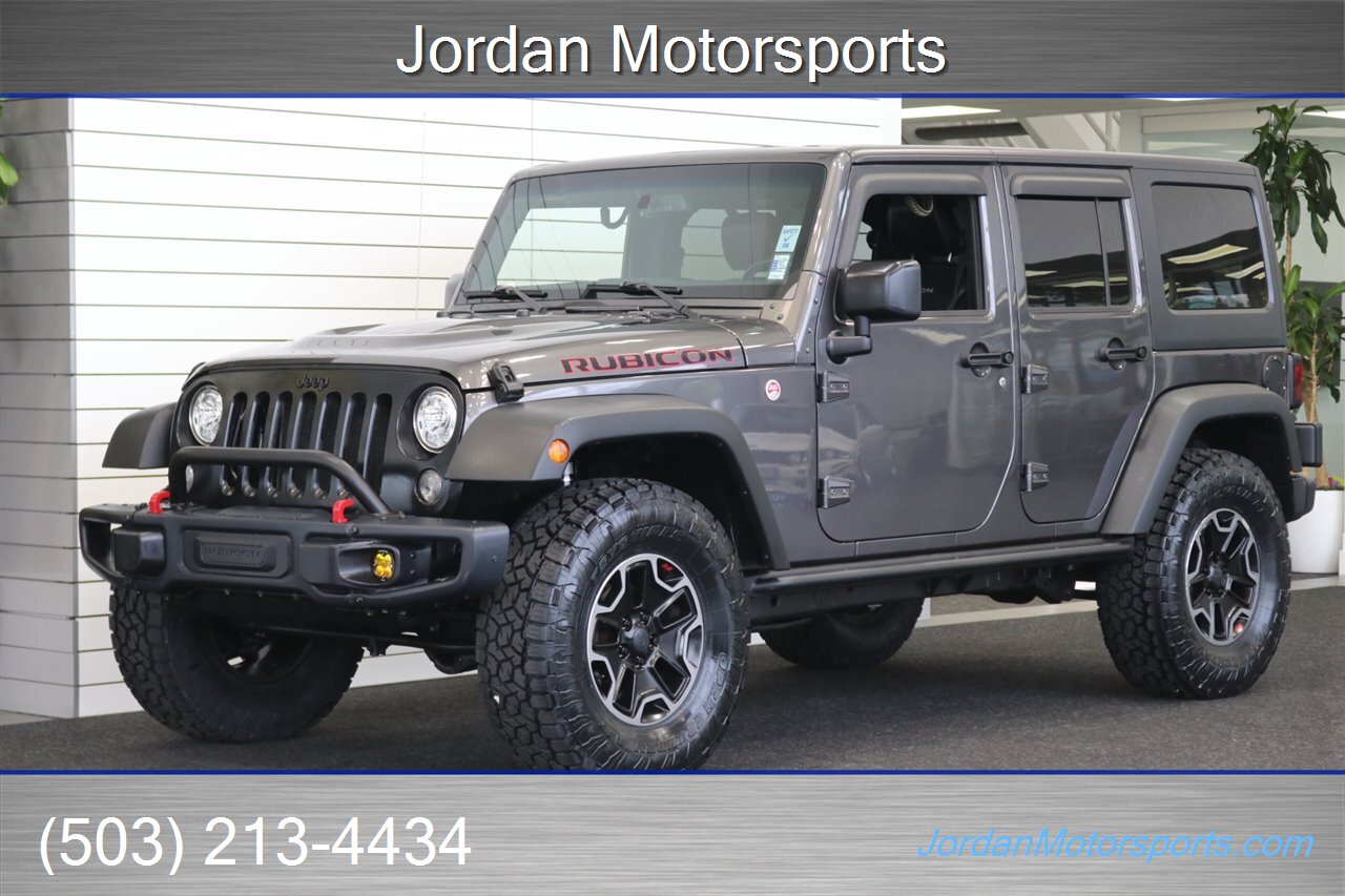 2017 Jeep Wrangler Rubicon Hard Rock HARD ROCK RUBICON W/ 6-SPEED MANUAL TRANSMISSION* 2 " TERRA FLEX W/ FOX SHOCKS* NEW 35 " TOYO A/T III TIRES* ROCK SLIDERS* ALL LED LIGHT UPGRADE PKG* ALL BOOKS & KEYS - Photo 1 - Portland, OR 97230