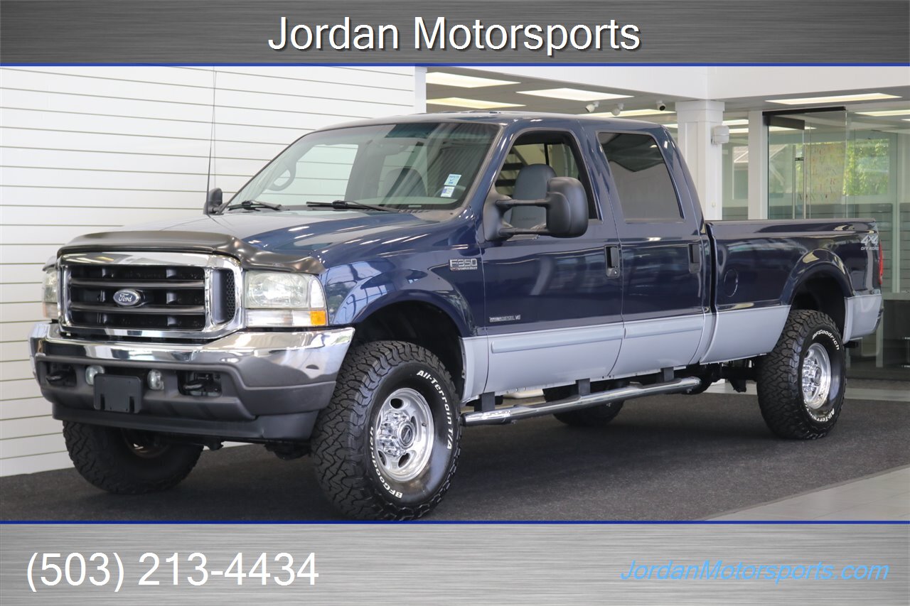 2002 Ford F-350 Lariat 1-OWNER* 100% RUST FREE* AFE INTAKE & FULL EXHAUST* NEW 2.5 "BILSTEIN LEVEL KIT* NEW 35 " BFG KO3 10-PLYs* ALL NEW BRAKE SYSTEM* ALL NEW FLUIDS* ALL SERVICE RECORDS* REAR AIRBAGS W/ ONBOARD AIR - Photo 1 - Portland, OR 97230