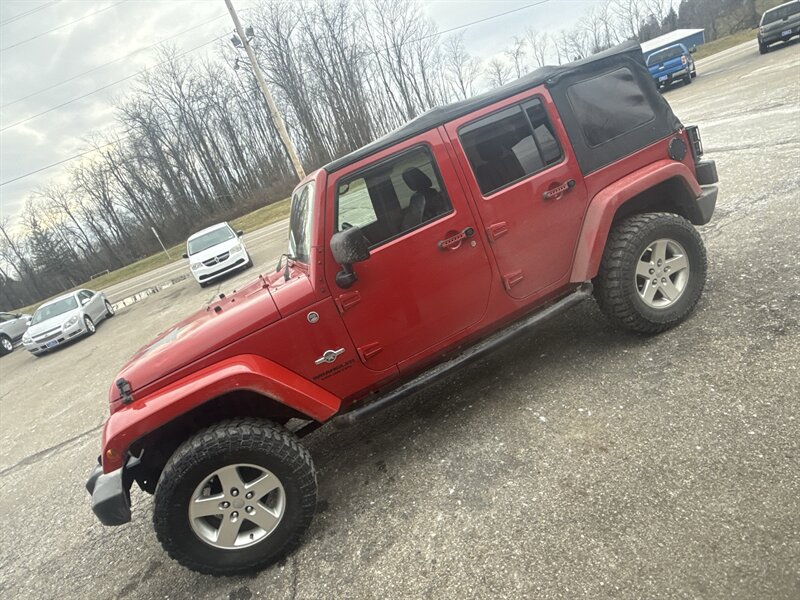 2014 Jeep Wrangler Unlimited Freedom Edition   - Photo 1 - Wintersville, OH 43953