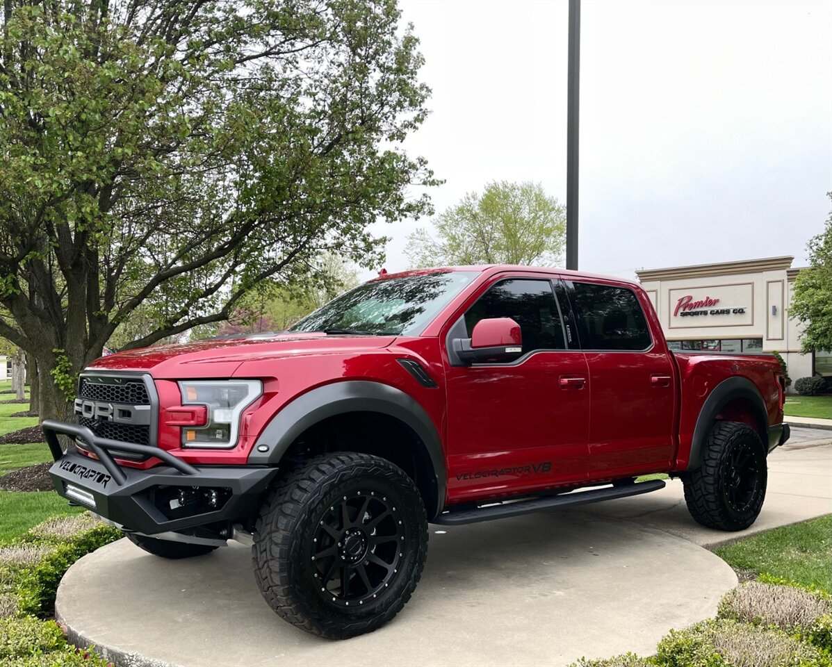 ford raptor lifted red