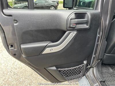 2016 Jeep Wrangler Unlimited Sahara   - Photo 18 - Clio, MI 48420