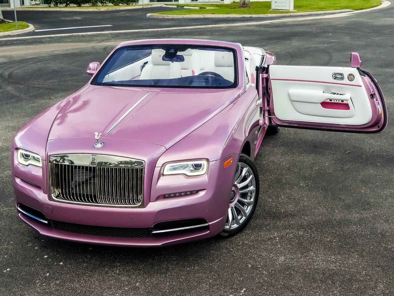 New photos of the exclusive RollsRoyce Dawn in Fuxia