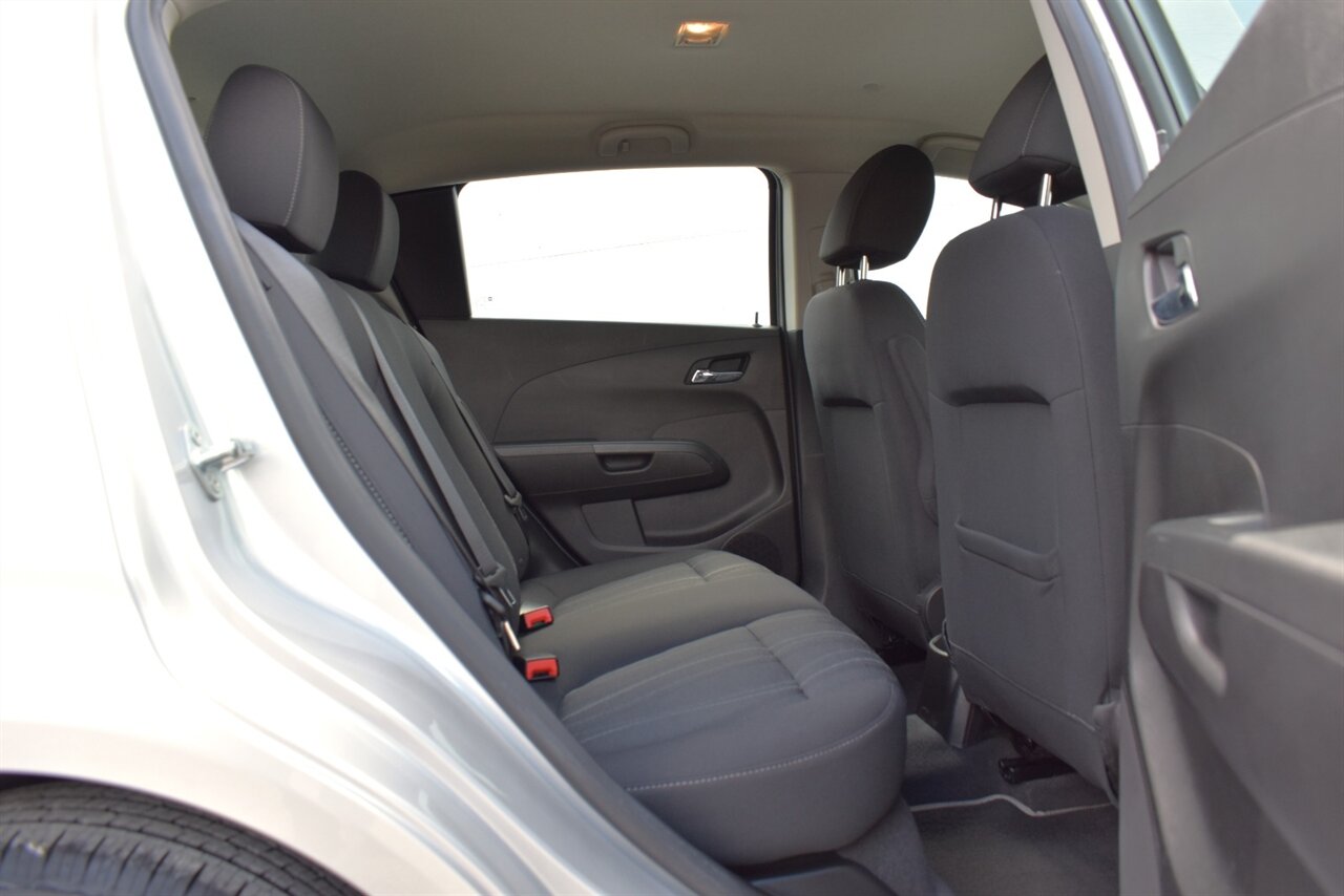 2012 Chevrolet Sonic LT 4dr Hatchback! 27 City MPG! 37 Hwy MPG! CD/Aux-In! Bluetooth Connectivity! Air Conditioning! Compact & Easy to Park! Front-Wheel Drive! Stability Control! Traction Control! Rear Child Safety Locks! - Photo 23 - Portland, OR 97266
